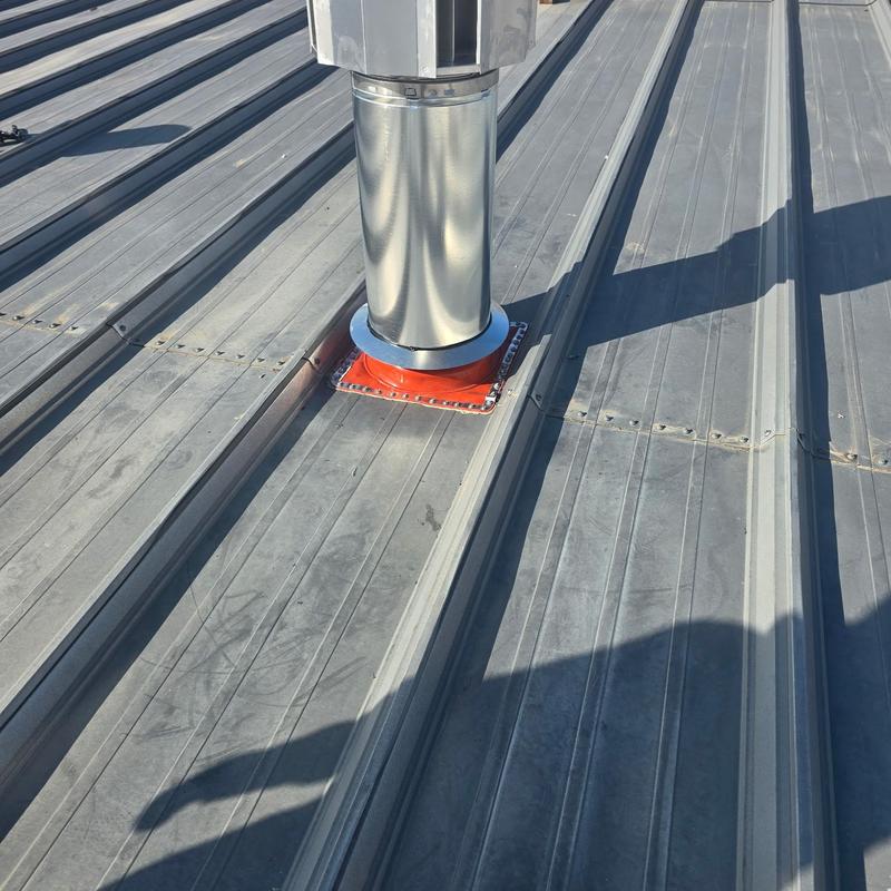 HT pipe boot on metal roof vent pipe installation HT pipe boot on metal roof vent pipe installation