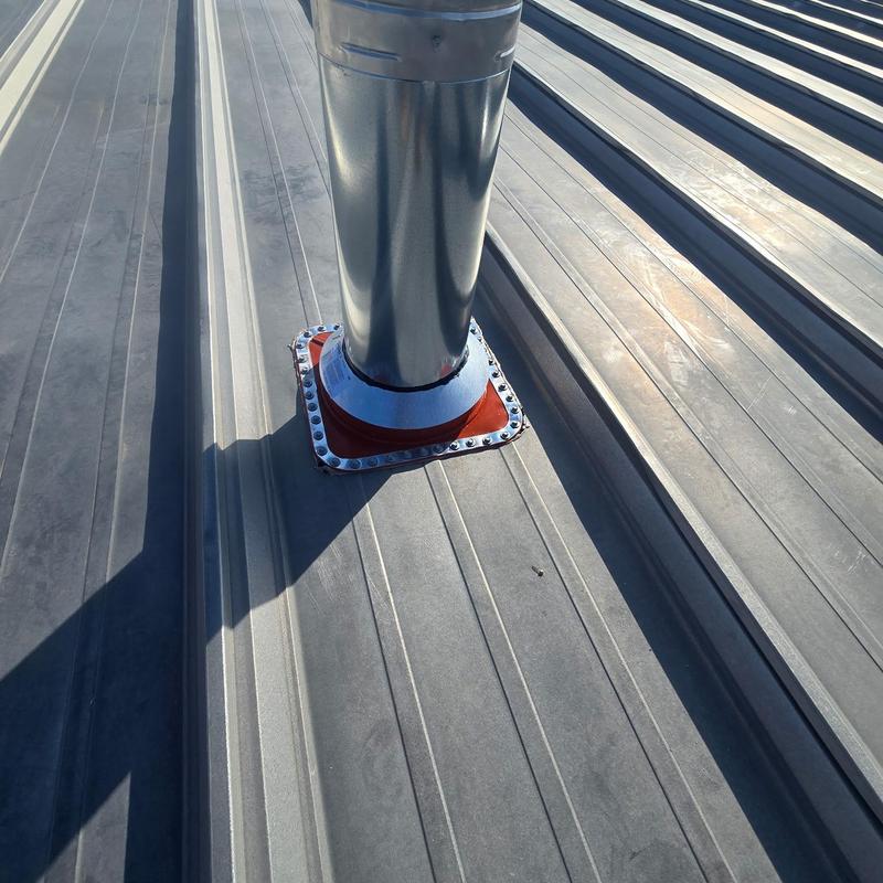 HT pipe boot on metal roof with flashing seal HT pipe boot on metal roof with flashing seal