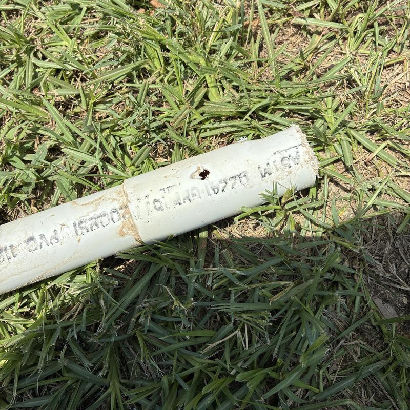 3/4 inch PVC pipe with hole in yard grass