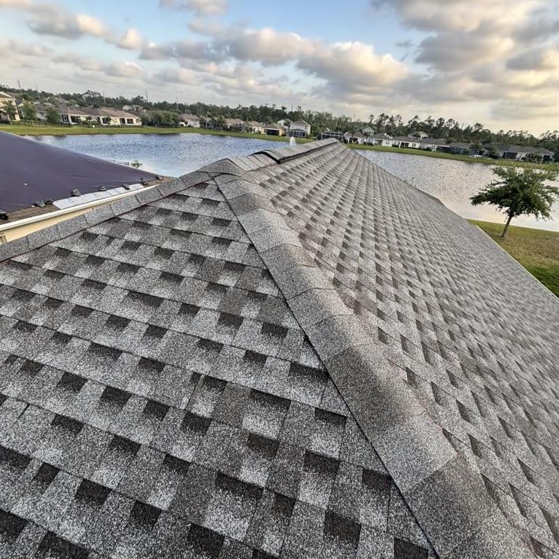 Architectural shingle roof with ridge cap near lake Architectural shingle roof with ridge cap near lake