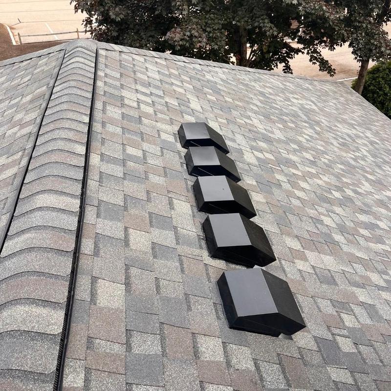 Roof shingles and black roof vents on new roof Roof shingles and black roof vents on new roof