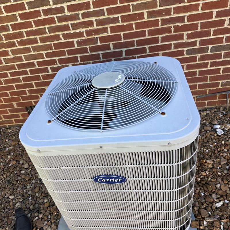 Carrier outdoor air conditioning unit with clean fan grille Carrier outdoor air conditioning unit with clean fan grille