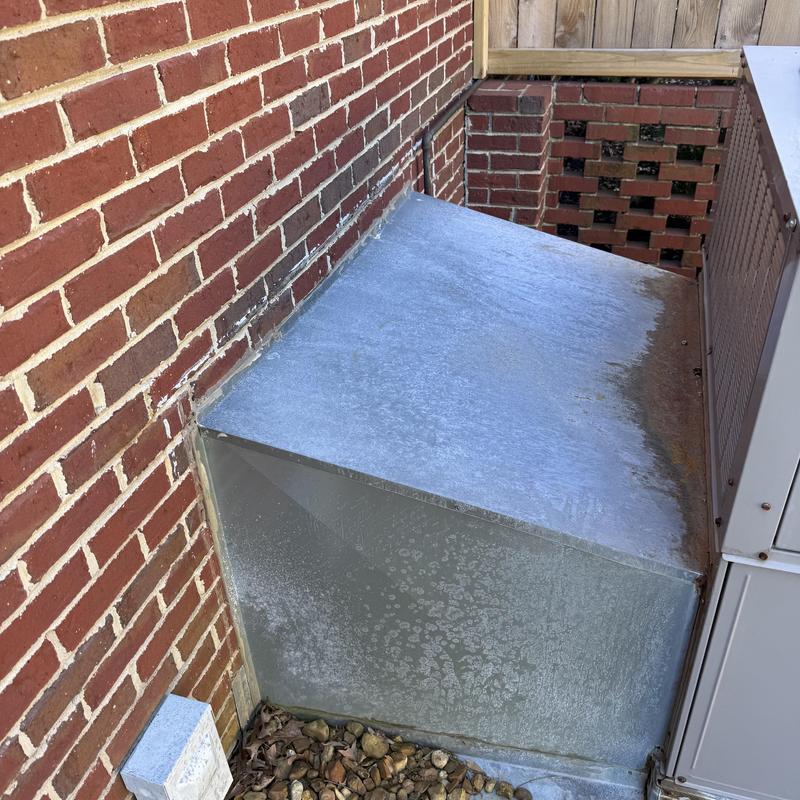 HVAC system outdoor unit with metal protective cover HVAC system outdoor unit with metal protective cover