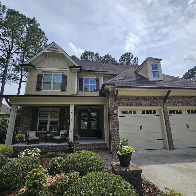 Roof shingles replacement on suburban two-story house