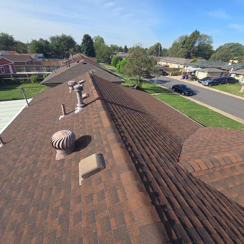 Asphalt shingle roof with ventilation pipes and damage inspection Asphalt shingle roof with ventilation pipes and damage inspection