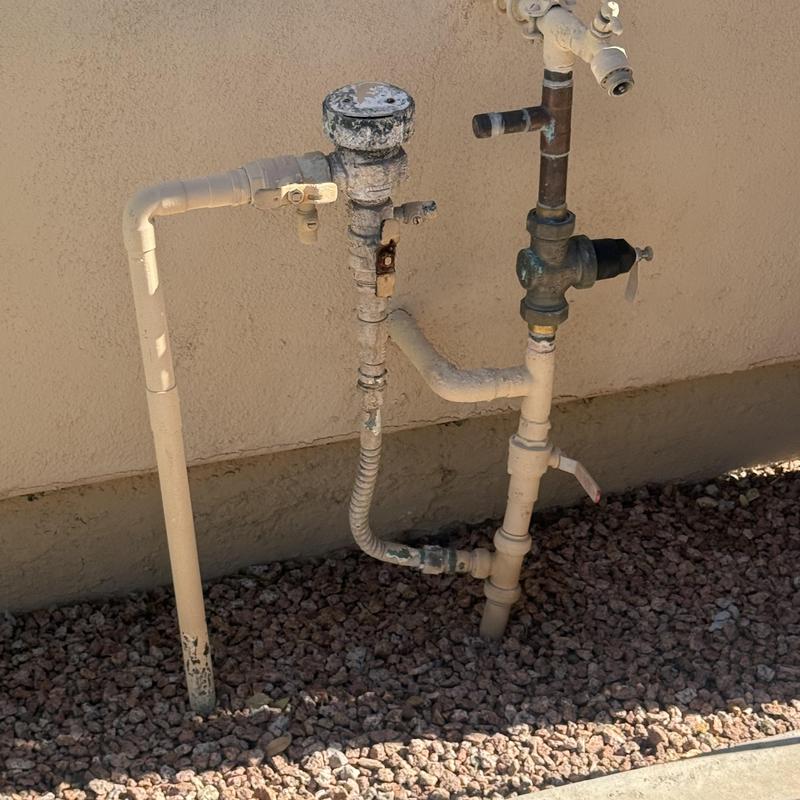 Outdoor hose bib assembly with shutoff valves and piping