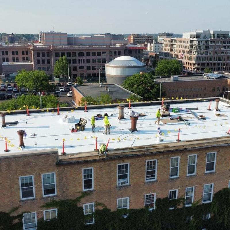 GAF EverGuard TPO membrane roof installation workers GAF EverGuard TPO membrane roof installation workers