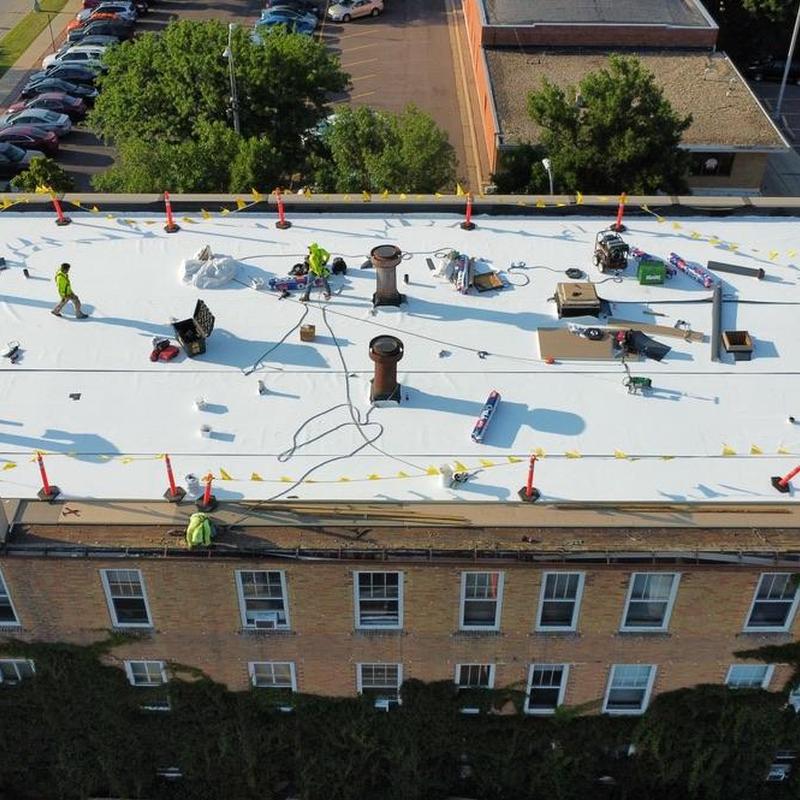 GAF EverGuard TPO membrane roof installation on building GAF EverGuard TPO membrane roof installation on building