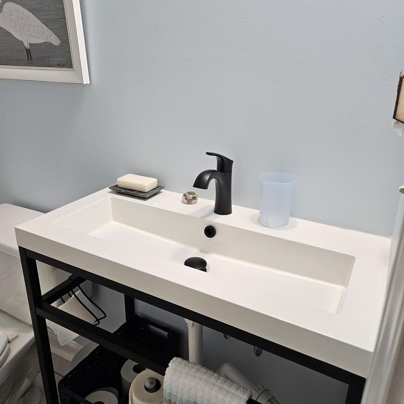 Bathroom sink with matte black faucet and modern vanity Bathroom sink with matte black faucet and modern vanity