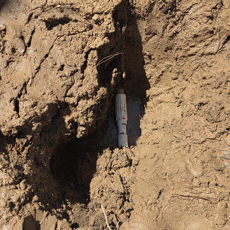1-inch PVC water service line in mud trench 1-inch PVC water service line in mud trench