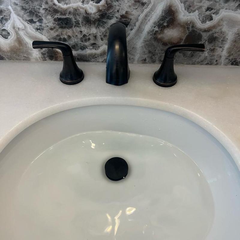 Widespread bathroom faucet installation with black finish Widespread bathroom faucet installation with black finish