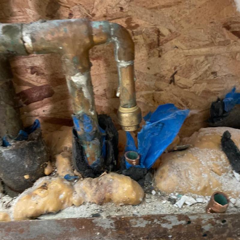Copper water pipes with capped feed and leak repair under concrete Copper water pipes with capped feed and leak repair under concrete