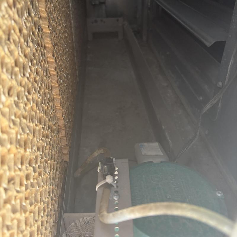 Swamp cooler interior with water line and cooling pad Swamp cooler interior with water line and cooling pad