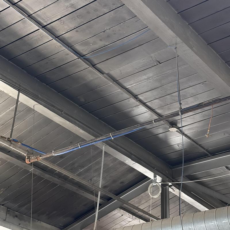 Swamp cooler water supply line on black ceiling beams Swamp cooler water supply line on black ceiling beams