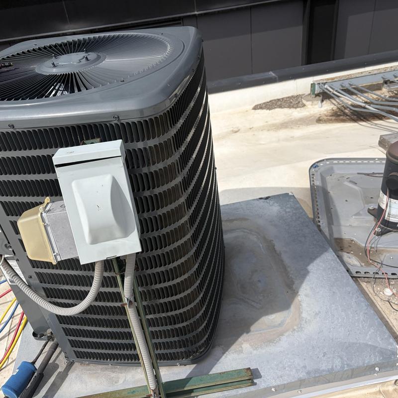 Rooftop HVAC condenser unit with wiring panel Rooftop HVAC condenser unit with wiring panel