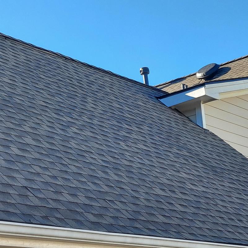 Asphalt shingle roof with vents on residential home Asphalt shingle roof with vents on residential home