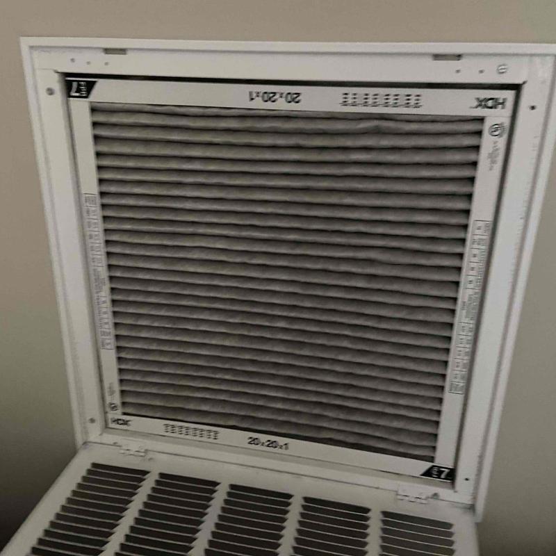 HVAC air filter installed in vent frame HVAC air filter installed in vent frame