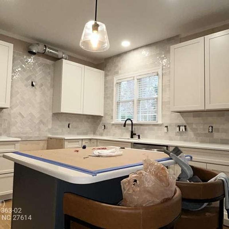 Kitchen tile backsplash installation with cabinetry Kitchen tile backsplash installation with cabinetry