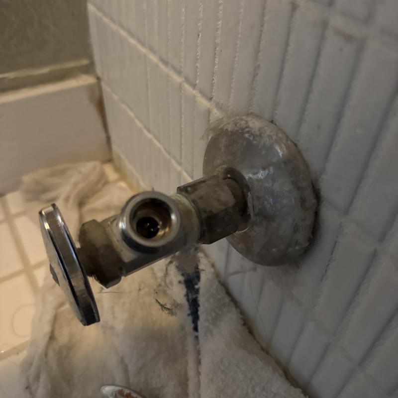 Toilet angle stop valve removed for repair