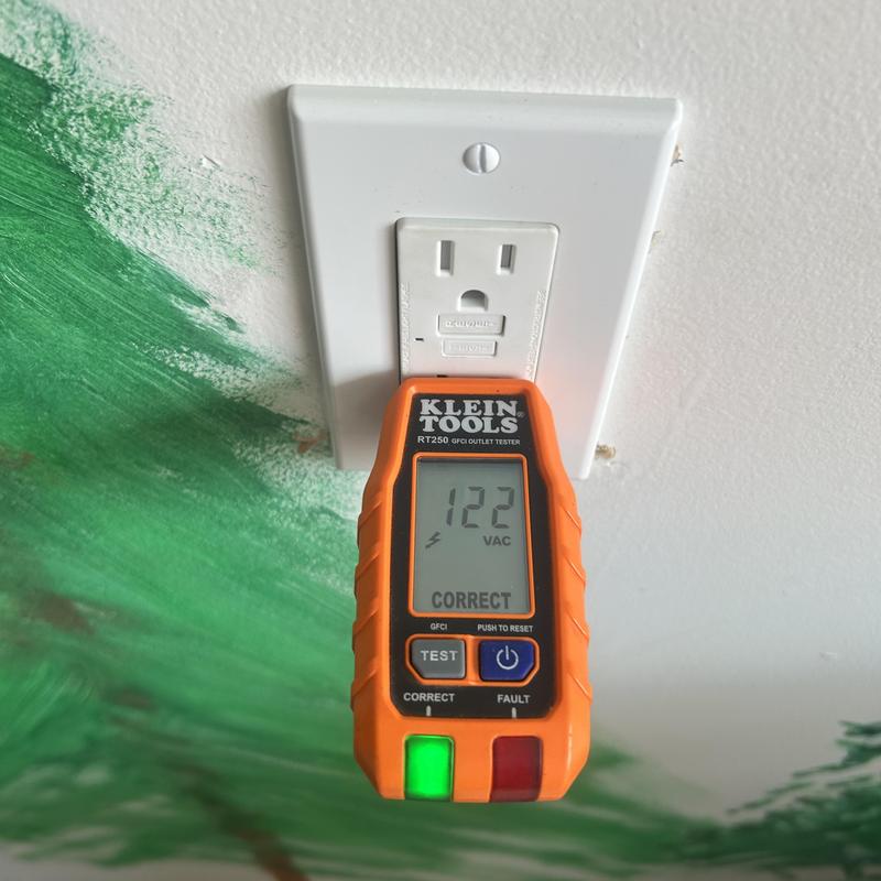 GFCI outlet voltage tester showing 122 VAC reading GFCI outlet voltage tester showing 122 VAC reading