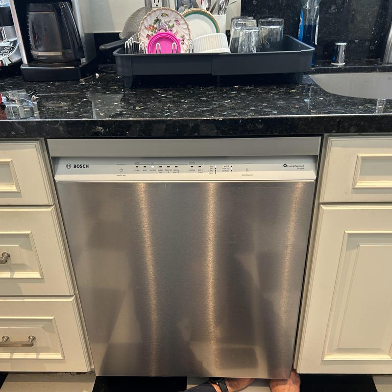 Dishwasher installation with new water line and drain hose