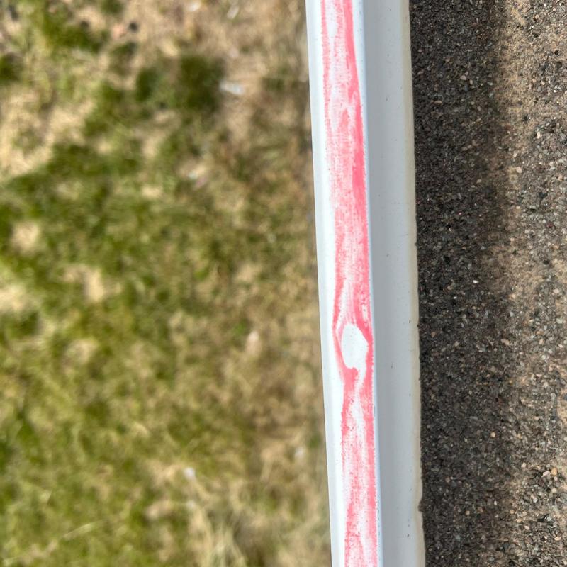 Gutter edge with red chalk marking and surface wear Gutter edge with red chalk marking and surface wear