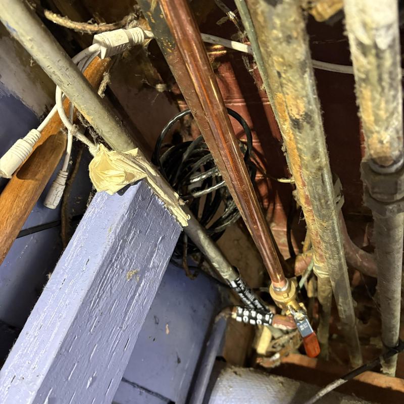 Copper hot water line with valve in ceiling space