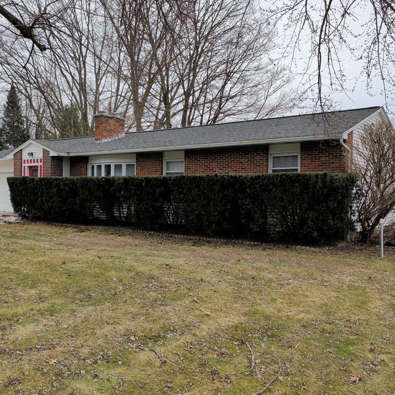 Asphalt shingle roof replacement on brick house