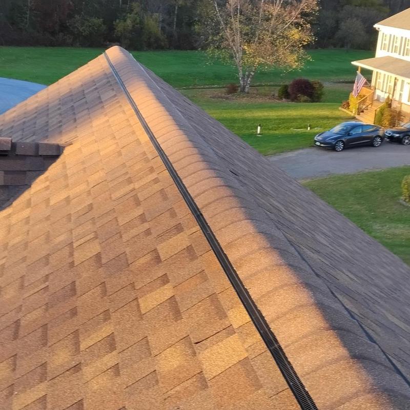 Asphalt shingle roof with ridge vent installation