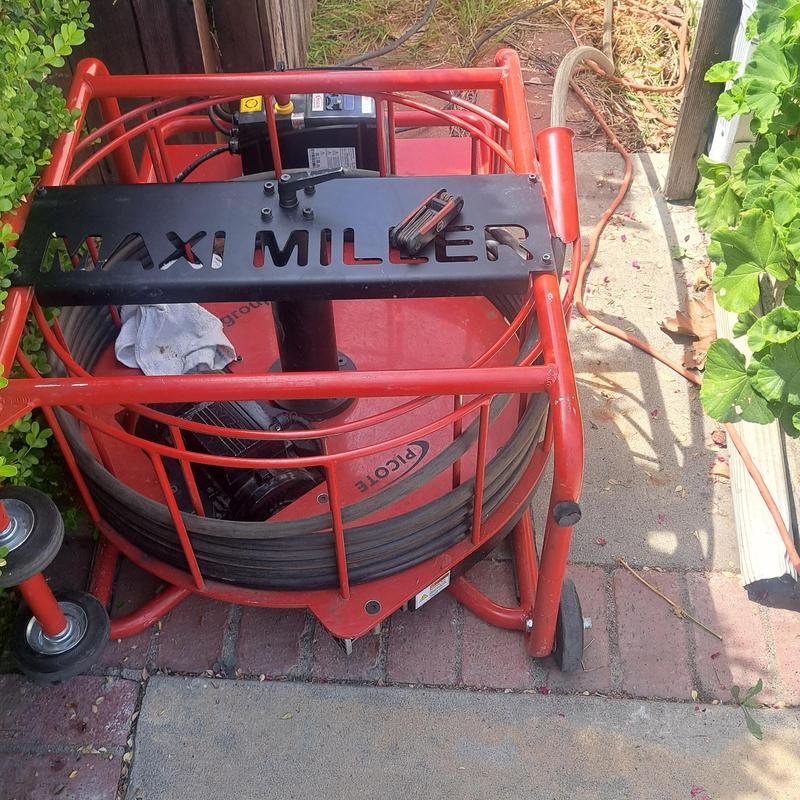 Sewer drain cleaning machine Maxi Miller on driveway