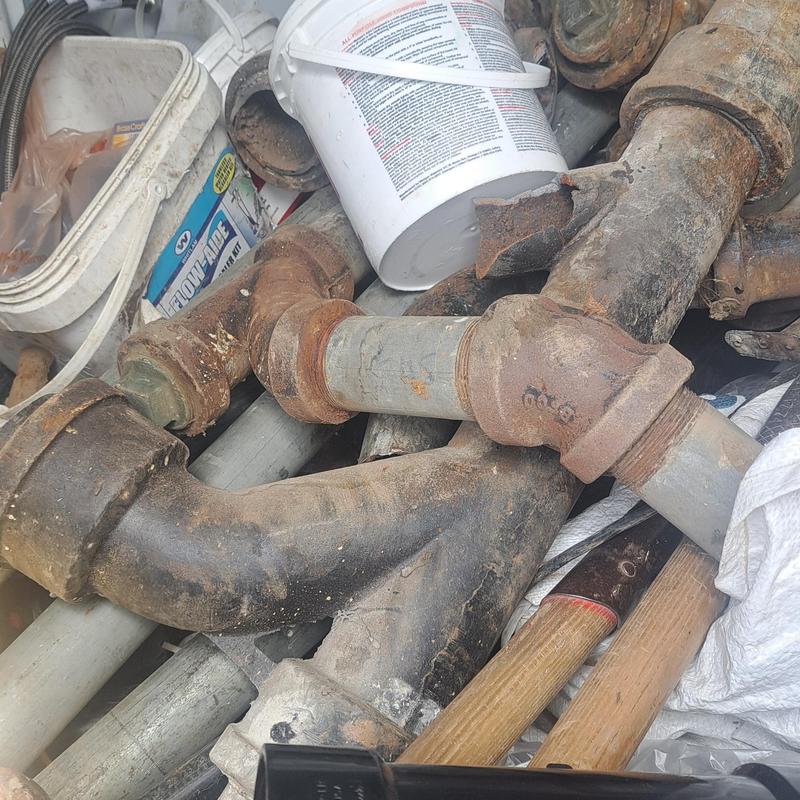 Cast iron drain pipes and fittings removed for replacement