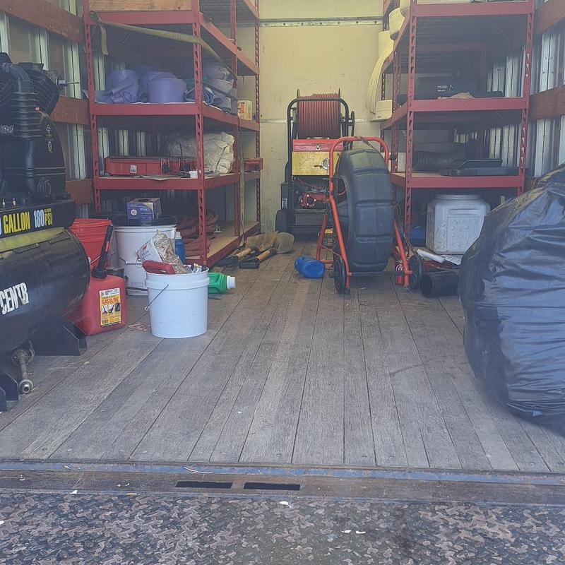 Cast iron drain pipes and sewer lining equipment inside truck