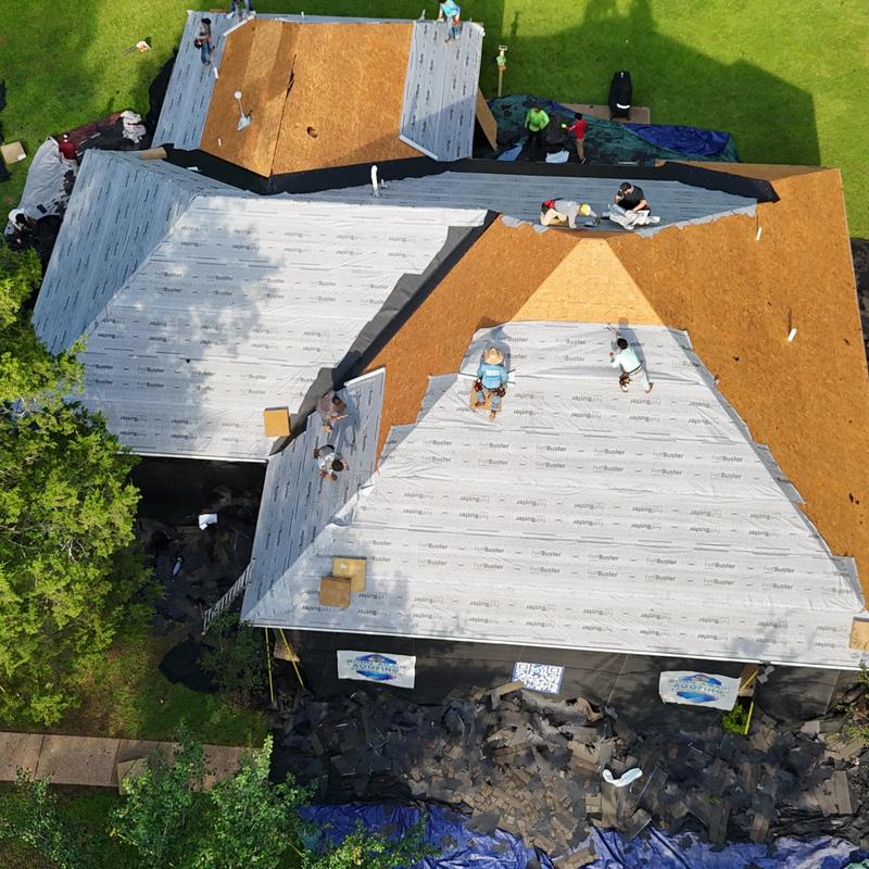Roof decking and underlayment installation in progress