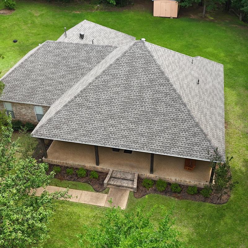 Asphalt shingle roof on residential home with porch