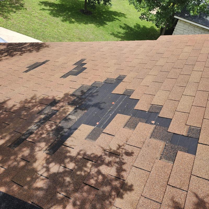25-year Cedar Brown shingles missing on roof section 25-year Cedar Brown shingles missing on roof section