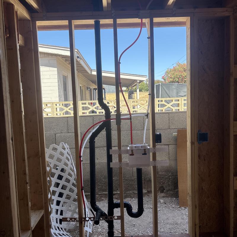Washer box plumbing and PVC drain installation in framing