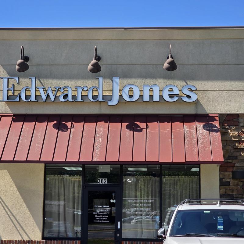 Roof leak inspection near HVAC unit at Edward Jones