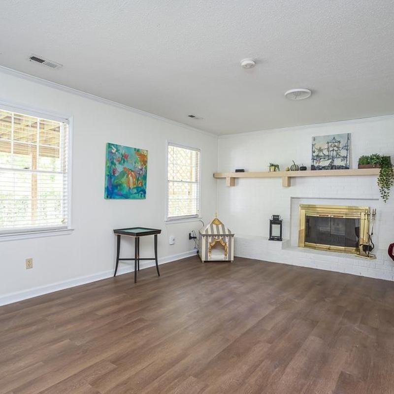 Fireplace with brass frame and wood flooring installation Fireplace with brass frame and wood flooring installation