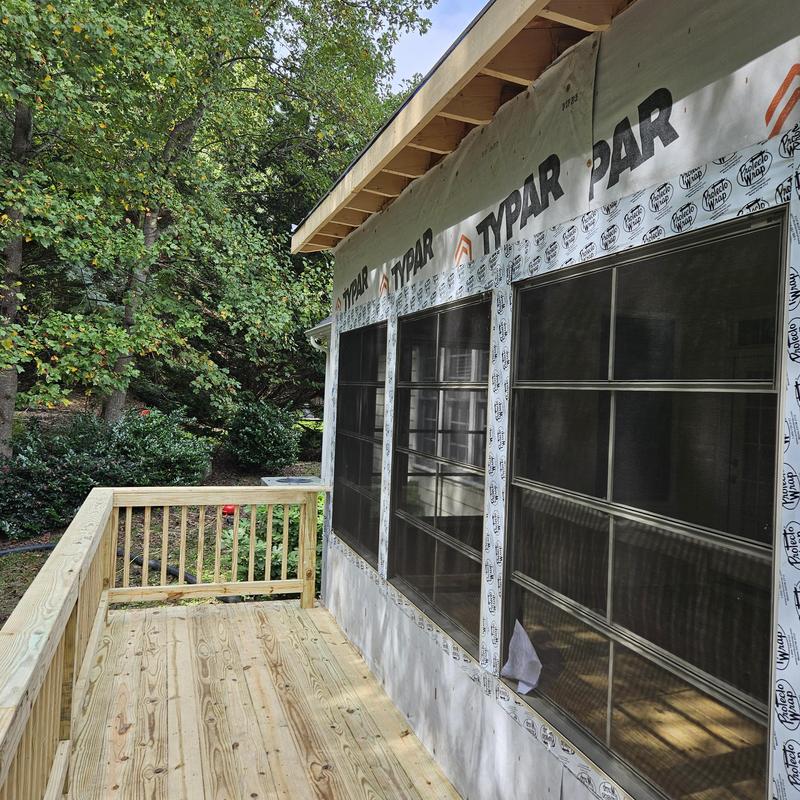 Deck with wood railing and new construction siding Deck with wood railing and new construction siding