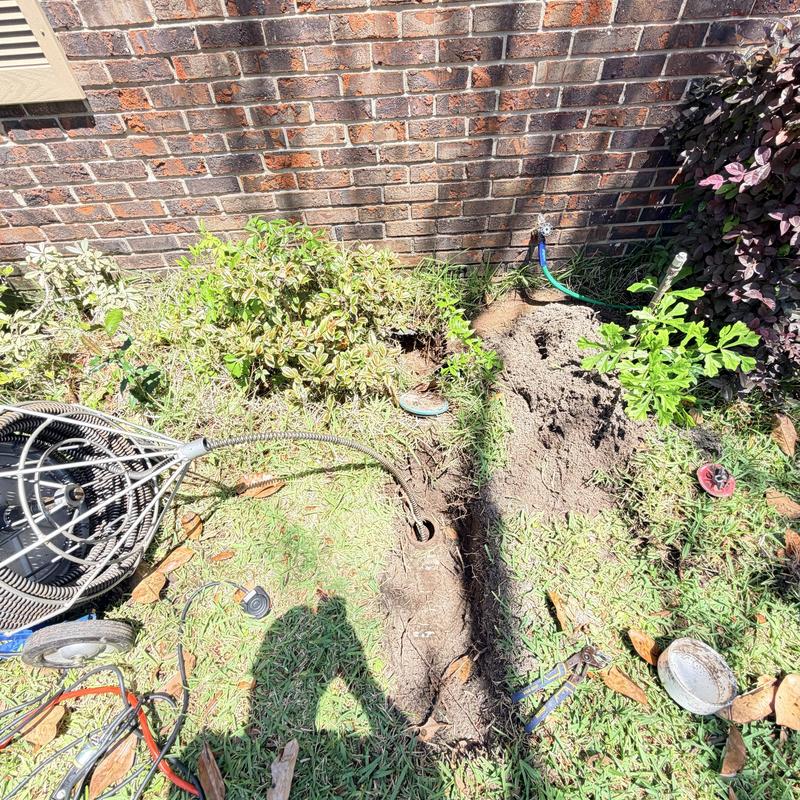Main sewer line with root cutter clearing blockage