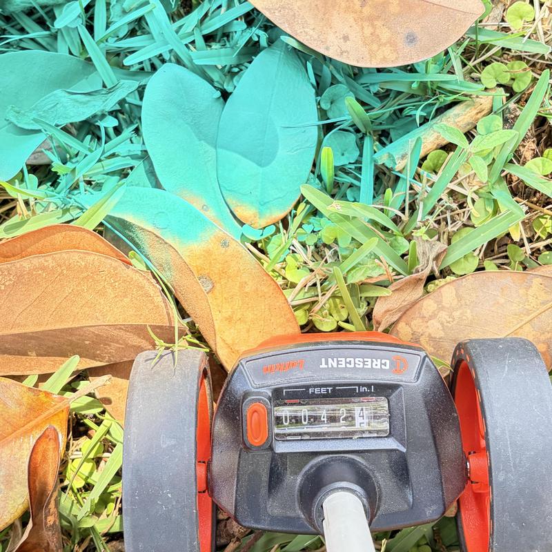 Sewer cleanout distance wheel measuring 42 feet on grass