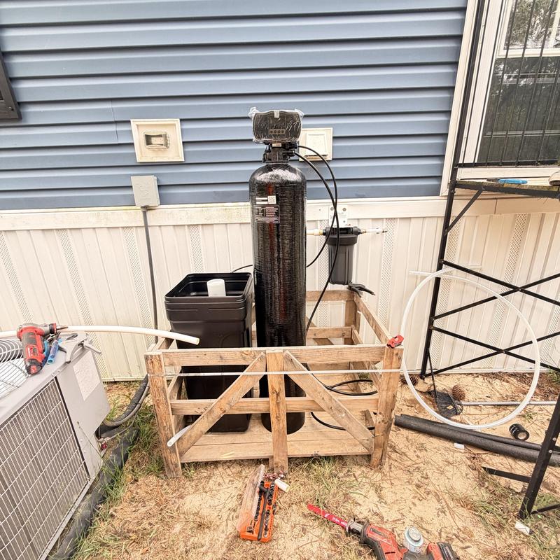 Whole home water filtration system with piping installation