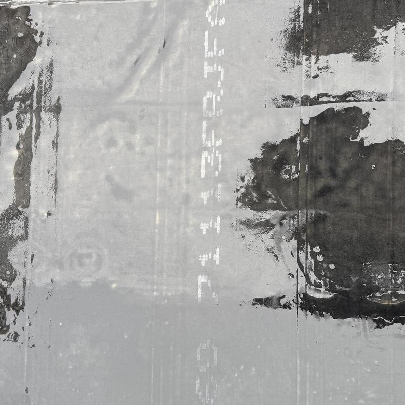 Carlisle Sure-Seal EPDM roof cover strip with adhesive application
