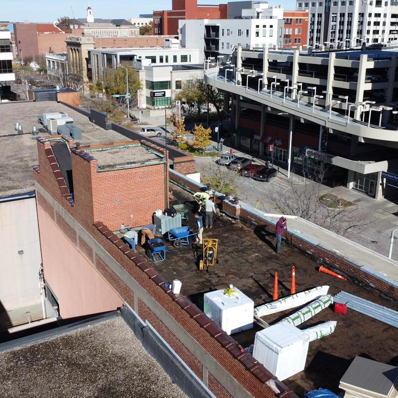Polyiso insulation installation on commercial roof