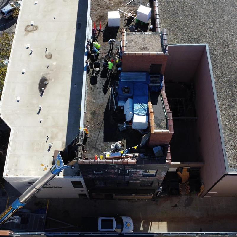 Carlisle SecurShield roof insulation installation crew