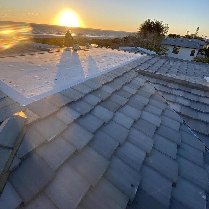 Eagle concrete tile roof with flat TPO system installation Eagle concrete tile roof with flat TPO system installation