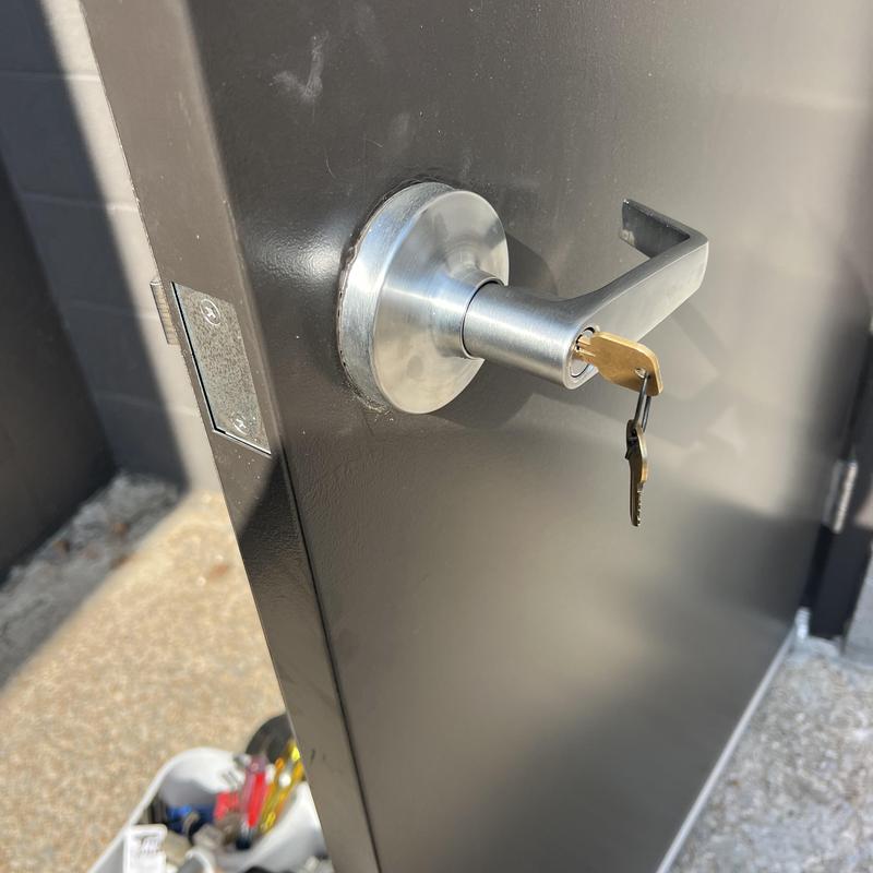 Commercial door lever with key inserted