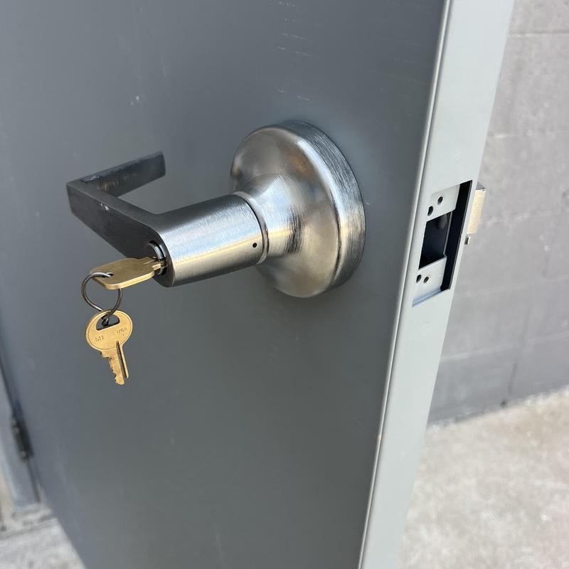 Commercial door lever lock with keys inserted