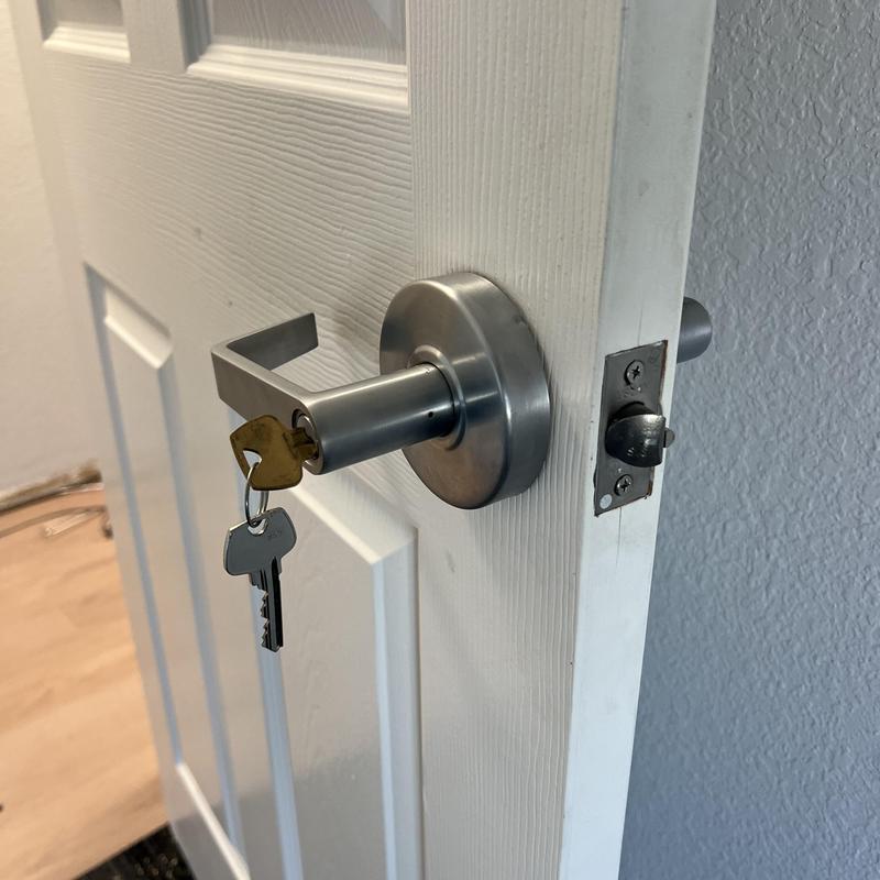 Office door lock with keys inserted in door handle