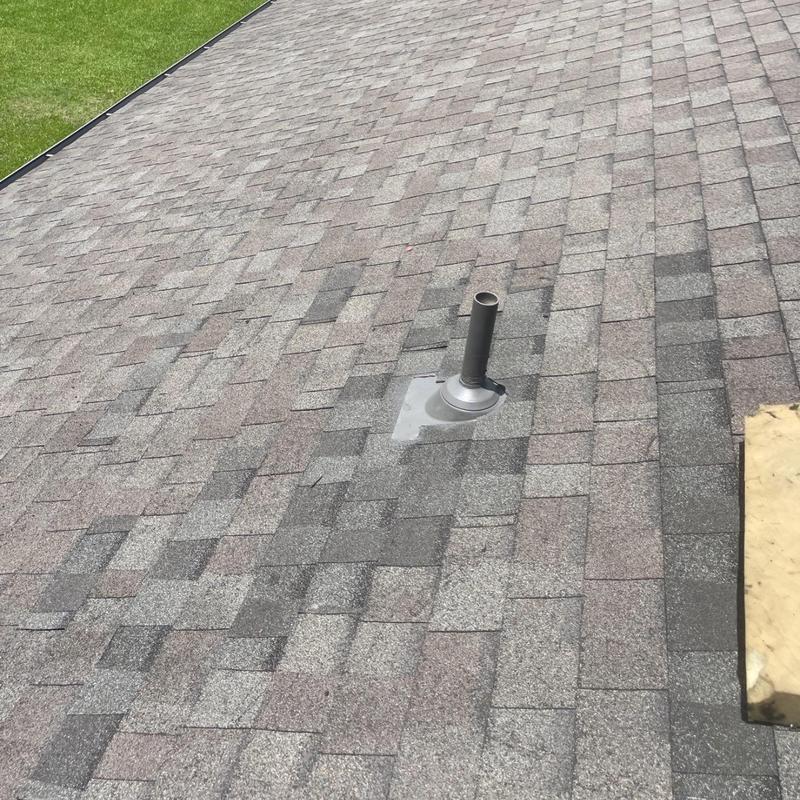 Plumbing vent pipe flashing on shingled roof